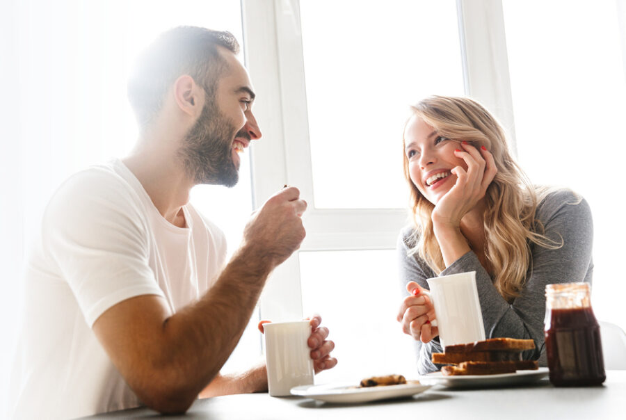 Couple discussing financial planning Sydney over coffee at home